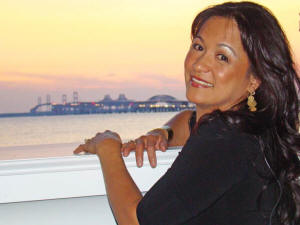 Veronica looks out the wondow from the Beach Club onto Chesapeake Bay & the Bay Bridge