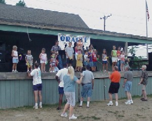 Kids on stage with the band while the dads make sure nobody takes a fall.