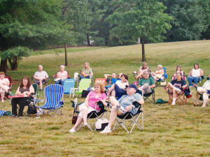 The audience slowly swelled. Most thought the concert would be cancelled because of the rain, but we knew the show must go on!