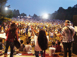 The lights illuminate the crowd as we prepare to conclude the evening's festivities before the fireworks